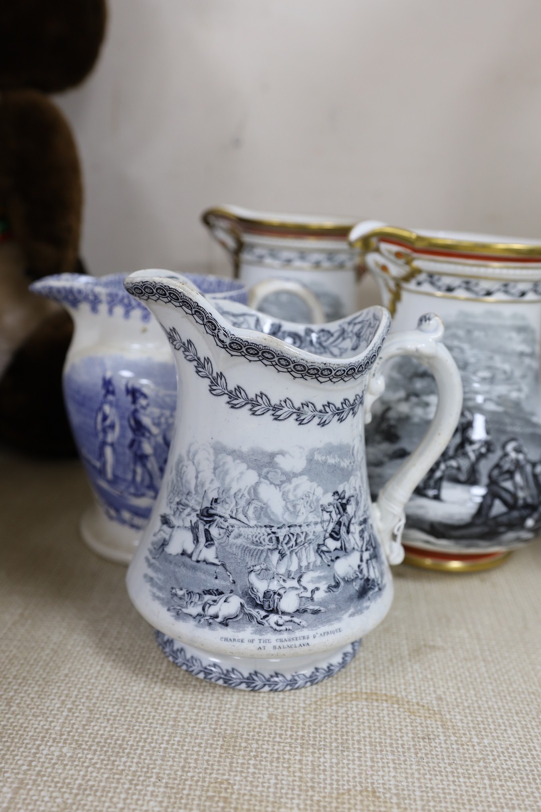 Two Victorian Royal Patriotic jugs by Samuel Alcock, 20cm, and 3 other printed jugs